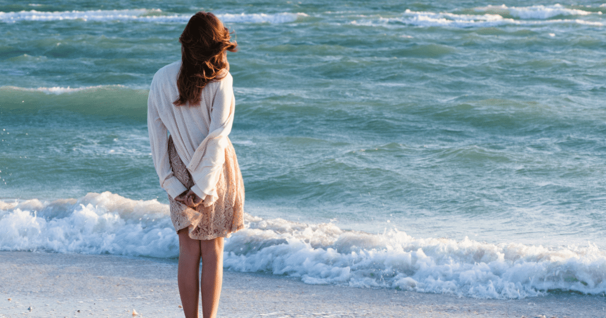 talking-therapy-heal-trauma-sydney.jpg Woman standing by the ocean in Sydney, reflecting on healing and emotional recovery after trauma.
